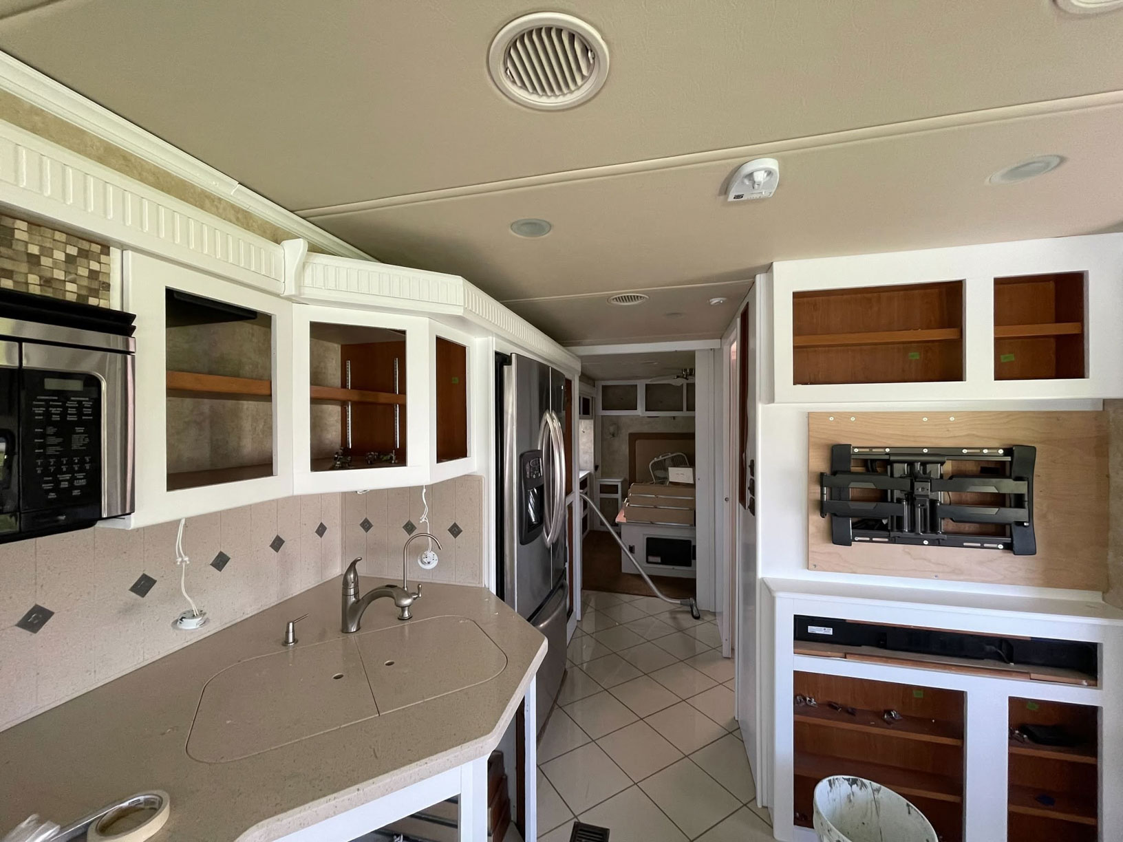 RV kitchen cabinets being prepared for painting